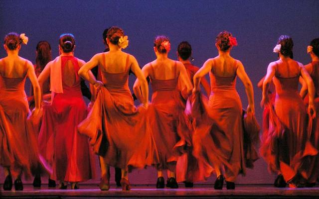 Photo of the dancers on stage facing away from the camera during a performance at the Strauss Theatre in Monroe, Louisiana