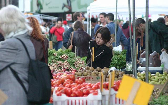 Photo of people shopping at a farmers market
